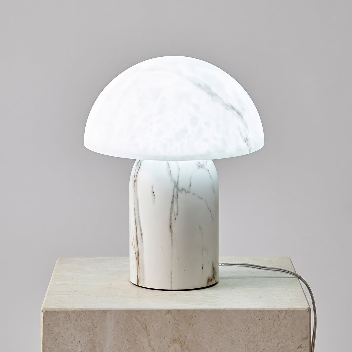 Aurisa mushroom lamp lit with bright white light