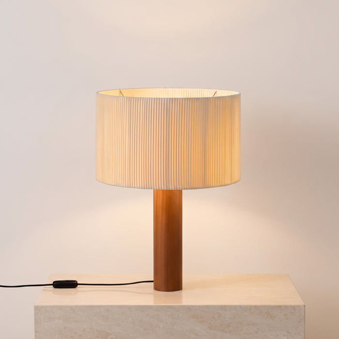 Brisenne pleated shade table lamp on a wooden column base