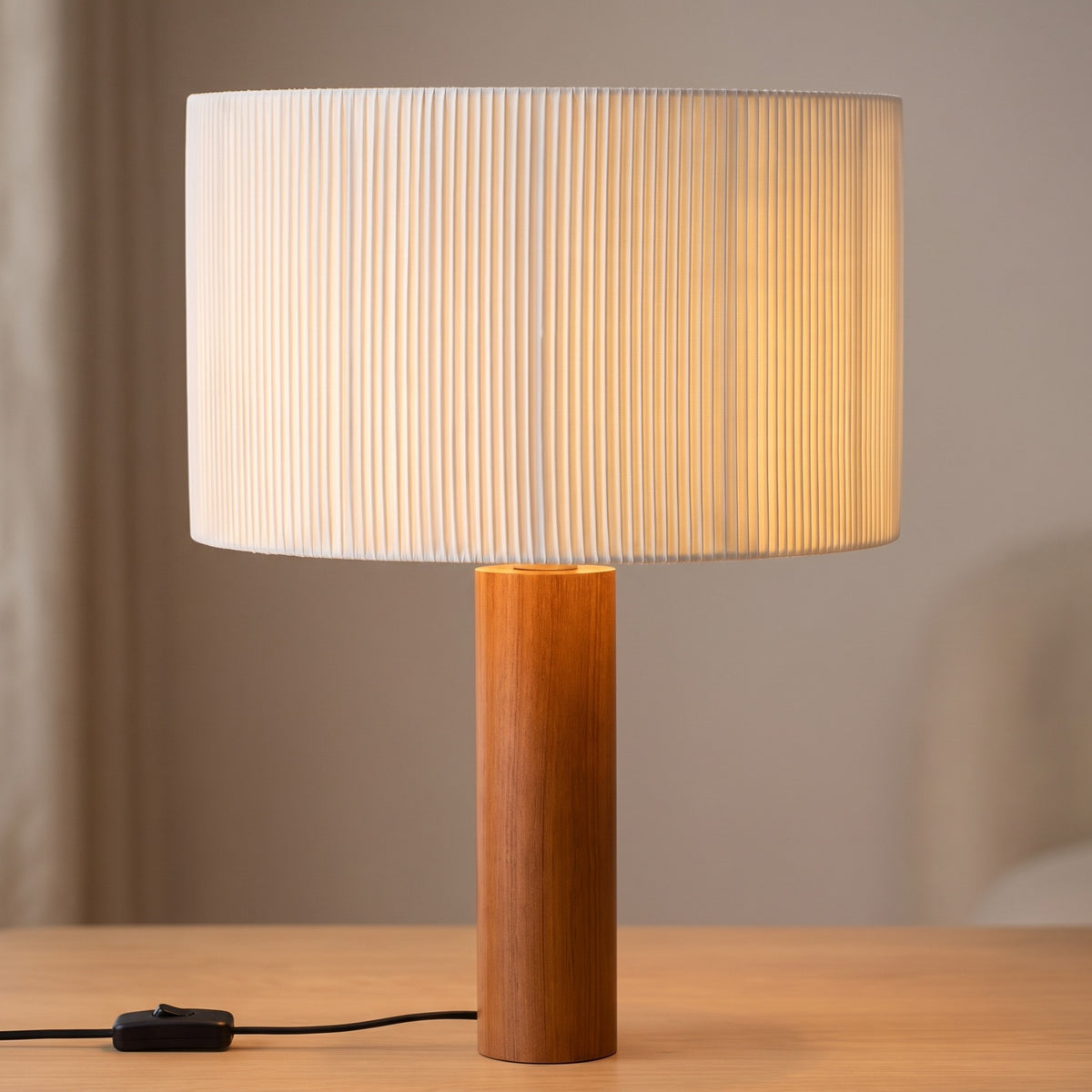 Close-up of the Brisenne pleated drum shade and wooden column