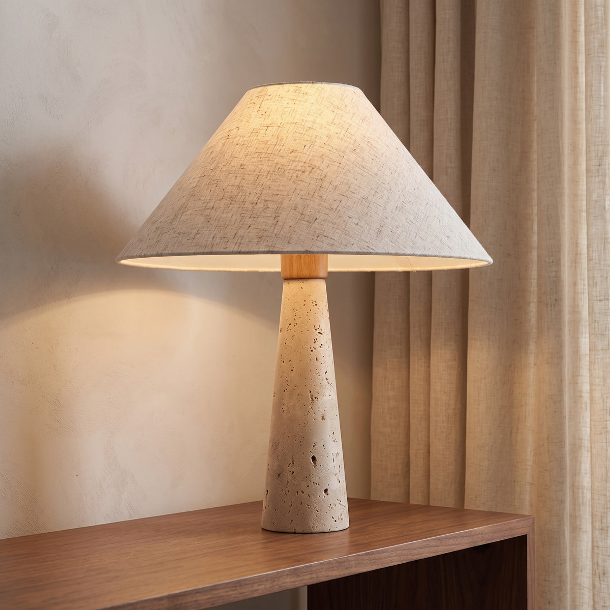 Cairnell travertine lamp on a walnut console