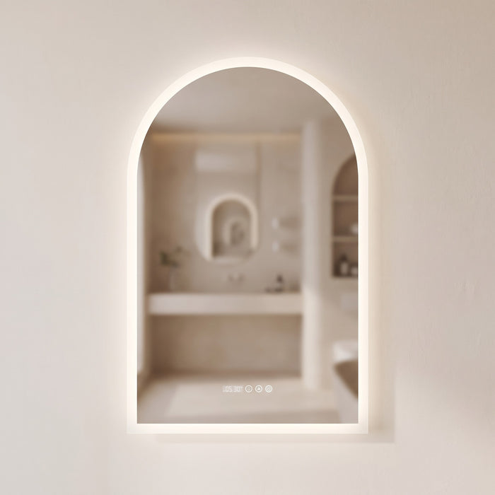Celestra arched LED bathroom mirror on a warm plaster wall