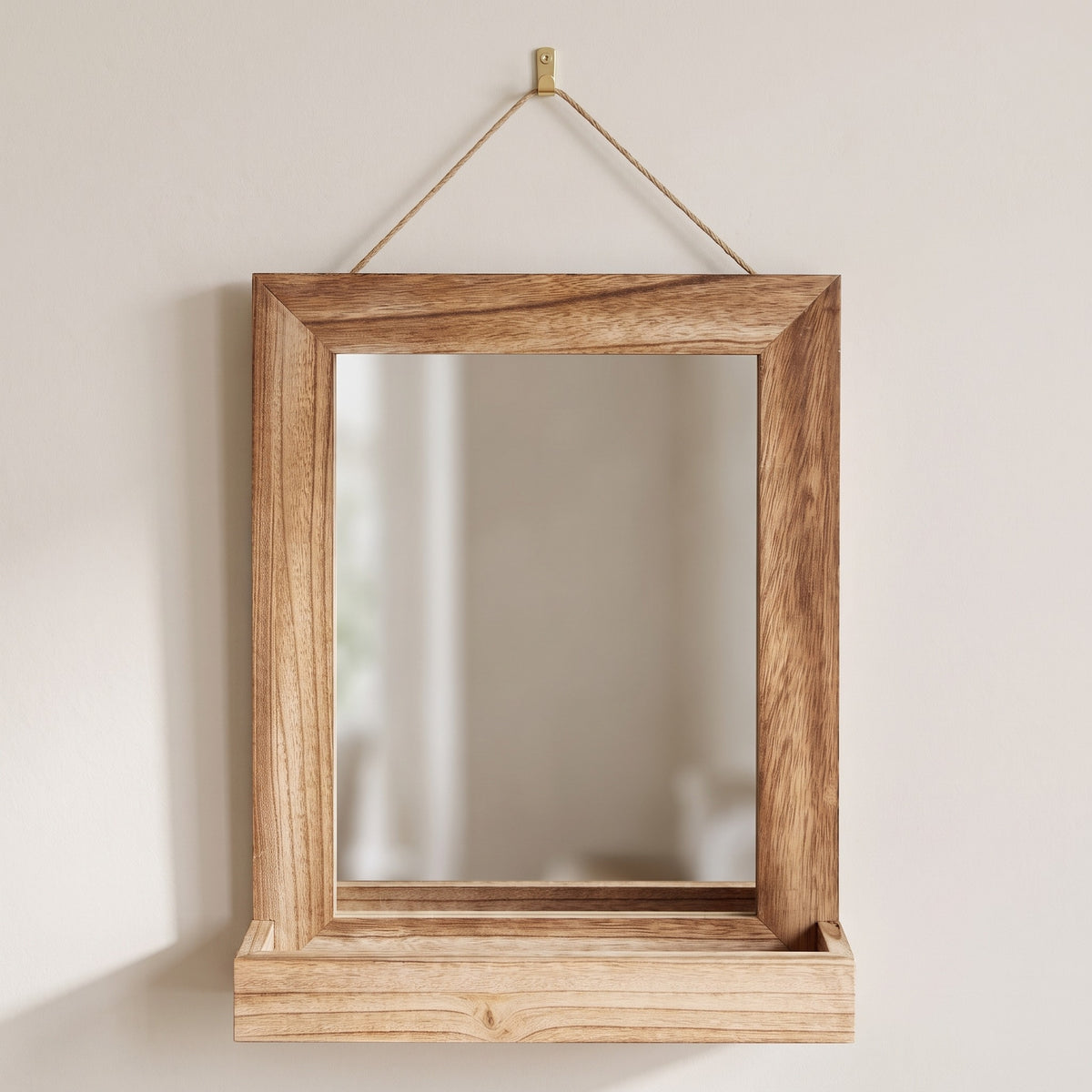 Fernley rustic wooden mirror with shelf hanging from a brass hook