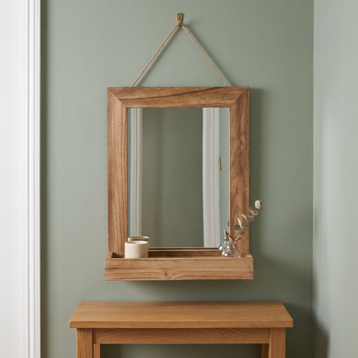 Fernley wooden mirror with shelf in a sage-green hallway