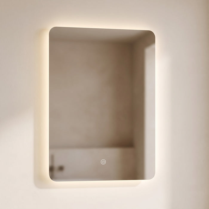 Halvane backlit LED bathroom mirror on a warm plaster wall