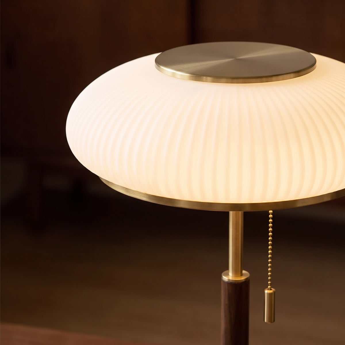 Close-up of the ribbed frosted glass shade and brass-tone cap