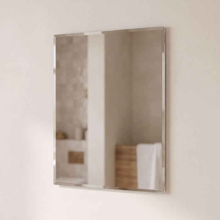 Nuvelle frameless bevelled-edge rectangular mirror on a warm plaster wall