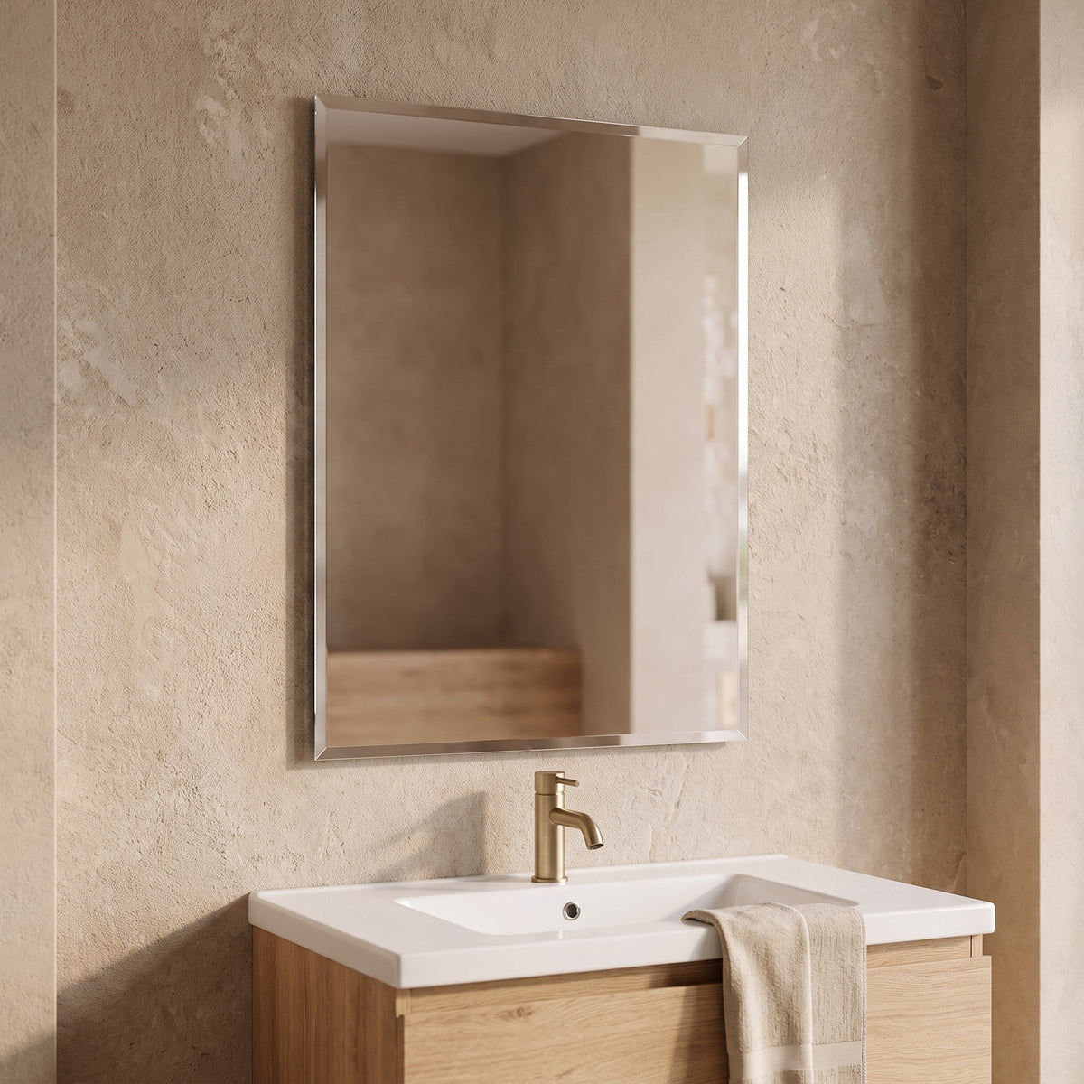 Nuvelle bevelled mirror above a basin on an oak vanity