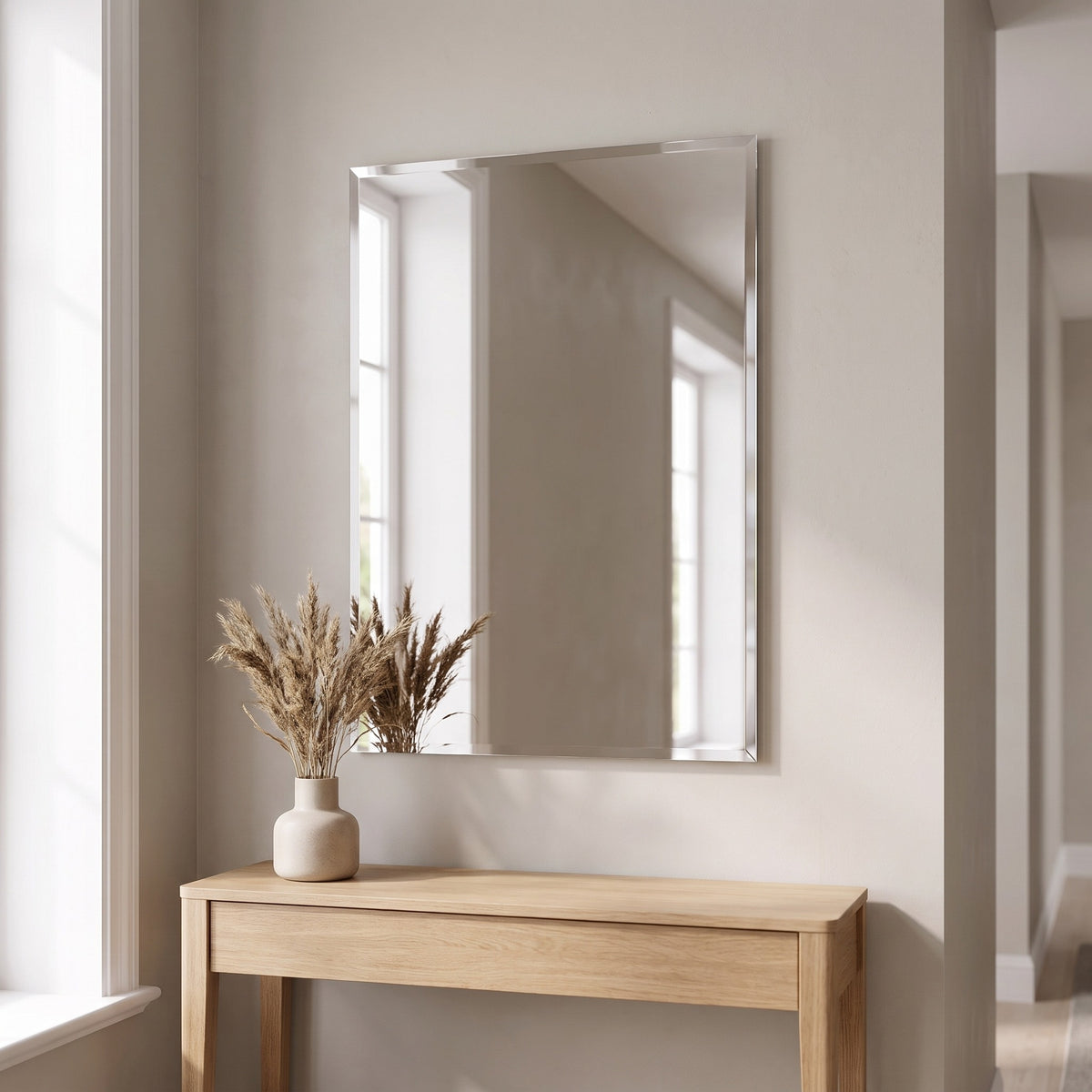 Nuvelle bevelled rectangular mirror above an oak console in a hallway