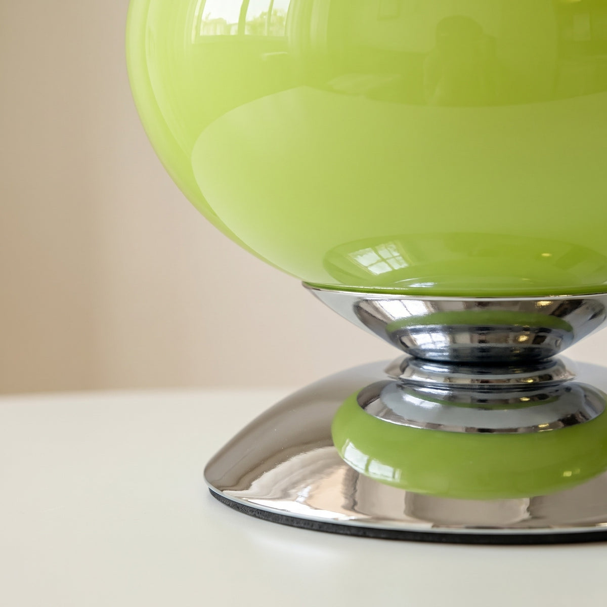 Close-up of the Pastelle chrome base with colour-matched ring