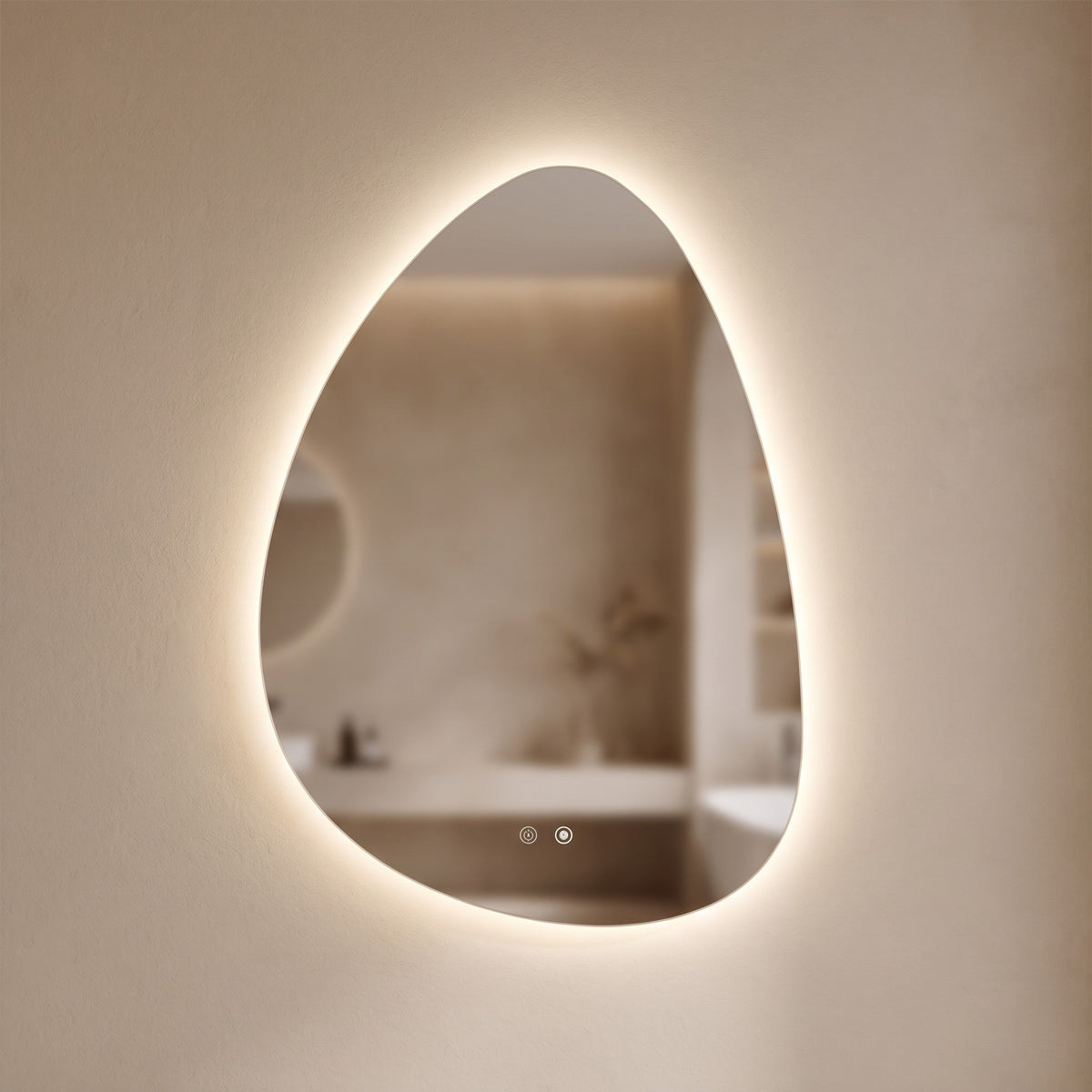 Pellora pebble-shaped LED backlit mirror glowing on a warm plaster wall