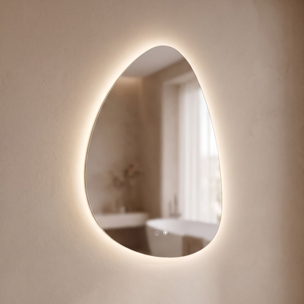 Pellora pebble LED mirror, angled view of the frameless edge and backlit halo
