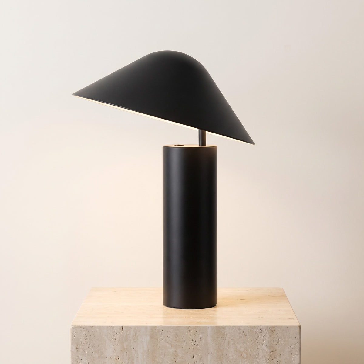 Sorrelle metal table lamp in matte black with tilted dome shade